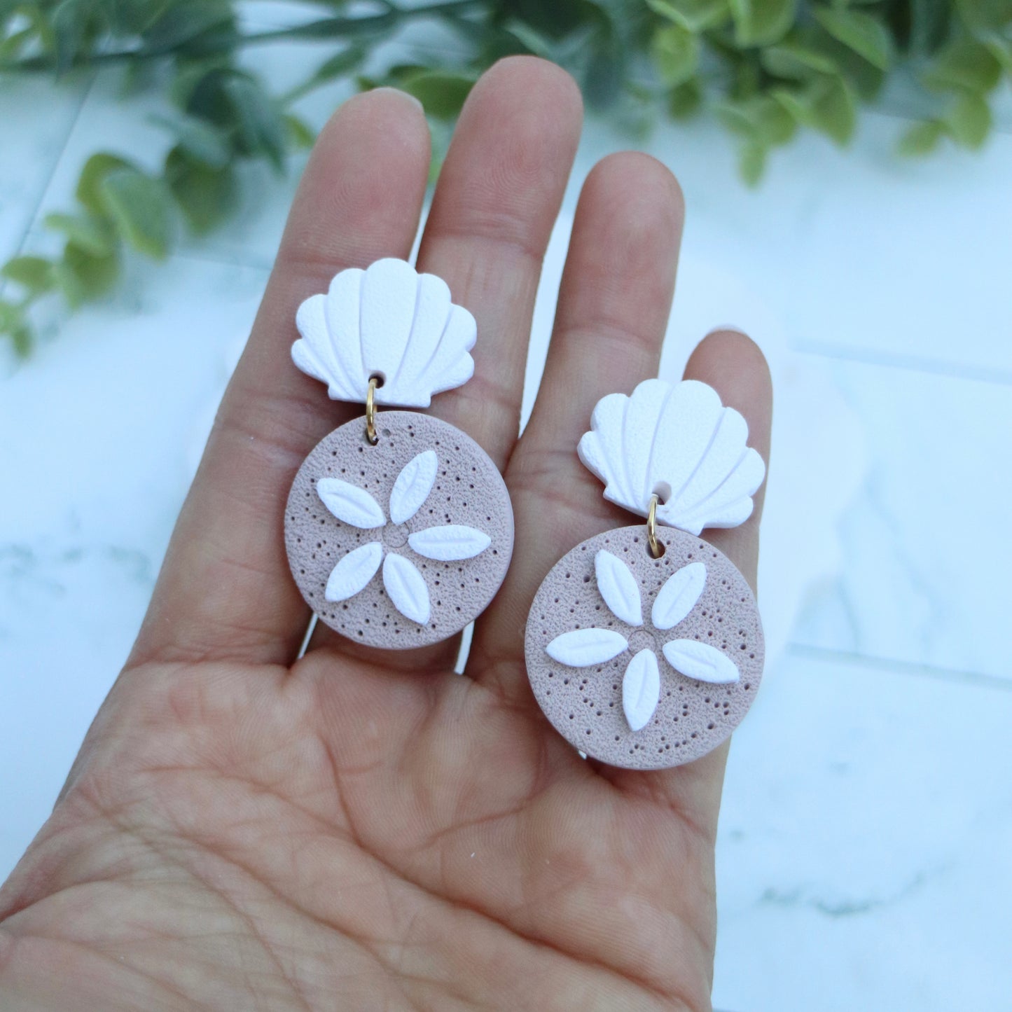Sand dollar earrings.